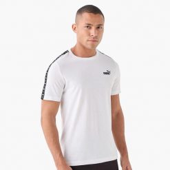Puma Koszulka Ess Tape 68467402. Białe koszulki sportowe męskie Puma, l, bez wzorów, z bawełny, bez kołnierzyka, bez ramiączek, na fitness i siłownię. Za 72.49 zł.