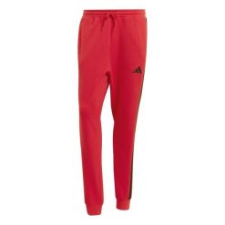 Spodnie Mężczyzna Adidas Essential 3 Stripes czerwony. Czerwone spodnie sportowe męskie Adidas, l, bez wzorów, z bawełny, na fitness i siłownię. Za 212.70 zł.