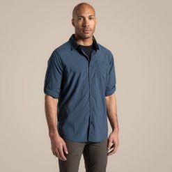 Koszula podróżnicza męska Craghoppers NosiLife Nuoro LS Shirt II. Niebieskie koszule męskie Craghoppers, na lato, m, bez wzorów, casualowe, bez kołnierzyka, bez ramiączek. Za 404.40 zł.