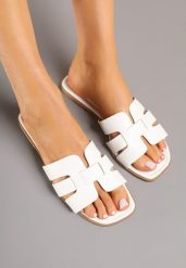 Białe Klapki z Ozdobnymi Paskami Dovina. Białe klapki damskie Renee, bez wzorów, z jeansu, eleganckie, bez obcasa, na płaskiej podeszwie. Za 44.99 zł.