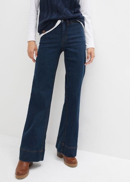 Dżinsy z szerokimi nogawkami, talią mid waist i wygodnym stretchem. Niebieskie jeansy damskie bonprix. Za 127.99 zł.