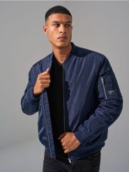 Kurtka bomber - granatowy. Niebieskie kurtki męskie Sinsay, l, bez wzorów, z satyny, bez kaptura. Za 79.99 zł.