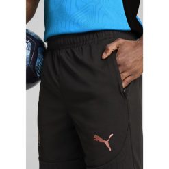 Męskie szorty treningowe Olympique Marsylia PUMA Black Copper Metallic. Czarne krótkie spodenki sportowe męskie Puma, m, bez wzorów, do piłki nożnej. Za 190.50 zł.