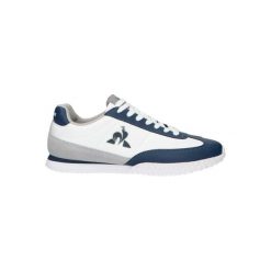 Tenisówki Le Coq Sportif Model Veloce Kolor Biały. Niebieskie obuwie sportowe damskie le coq sportif, bez wzorów, ze skóry, sportowe, bez zapięcia. Za 304.00 zł.