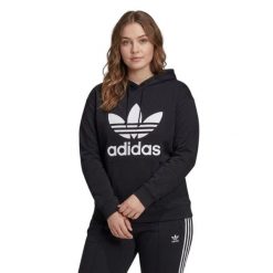 Bluza sportowa damska Adidas Trefoil Hoodie oversize. Czarne bluzy damskie Adidas, plus size, bez wzorów, z bawełny, z kapturem. Za 192.00 zł.