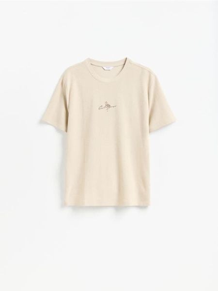 T-shirt relaxed z nadrukiem - beżowy. Brązowe t-shirty męskie Reserved, l, bez wzorów, z bawełny, bez kołnierzyka. W wyprzedaży za 39.99 zł.