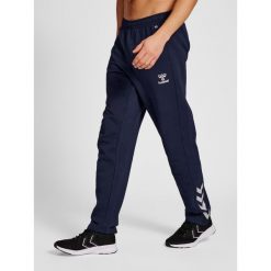 Spodnie do piłki nożnej męskie Hummel hml Core. Niebieskie spodnie sportowe męskie Hummel, m, bez wzorów, na fitness i siłownię. Za 177.50 zł.