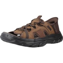 Sandały SKECHERS SLIP-INS REVOLTED SS Brązowy. Brązowe sandały męskie Skechers, z materiału, bez zapięcia. Za 333.99 zł.