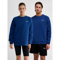 Bluza Hummel Tech. Niebieskie bluzy damskie Hummel, na zimę, bez wzorów, z bawełny, klasyczne, bez kołnierzyka, bez ramiączek, bez kaptura. Za 286.50 zł.