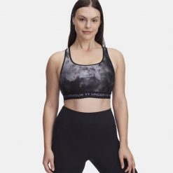 Biustonosz treningowy Under Armour Crossback Mid Print black/titan gray/titan. Czarne obuwie sportowe damskie Under Armour, bez wzorów, na fitness i siłownię. W wyprzedaży za 99.00 zł.