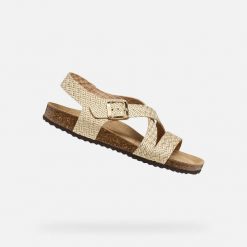 Sandały GEOX D BRIONIA Złoty. Żółte sandały damskie Geox, bez wzorów, ze skóry, bez obcasa, bez zapięcia. Za 350.99 zł.