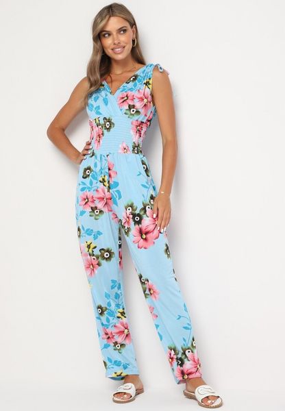 Jasnoniebieski Kombinezon w Kwiaty z Trójkątnym Dekoltem i Troczkami na Ramionach Benan. Niebieskie sukienki damskie Born2be, na co dzień, na lato, m, bez wzorów, eleganckie, bez kołnierzyka, bez ramiączek, dopasowane. Za 29.99 zł.