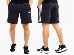 Spodenki męskie adidas Essentials Fleece 3-Stripes Shorts. Niebieskie krótkie spodenki sportowe męskie Adidas, m, bez wzorów, z bawełny, na fitness i siłownię. Za 134.99 zł.