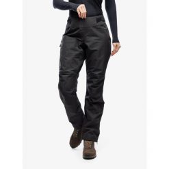 Spodnie damskie Helly Hansen Odin 9 Worlds Infinity Shell Pant. Czarne spodnie sportowe damskie Helly Hansen, l, bez wzorów, trekkingowe. W wyprzedaży za 1,666.50 zł.