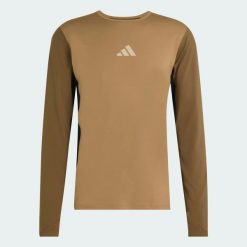Syntetyczna koszulka TERREX MULTI, pełniąca funkcję warstwy podstawowej. Brązowe koszulki sportowe męskie Adidas, l, bez wzorów, z dzianiny, bez kołnierzyka, bez ramiączek, outdoorowe, climacool (adidas). Za 219.00 zł.