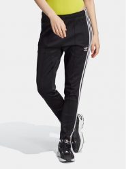Adidas Spodnie dresowe adicolor SST IK6600 Czarny Slim Fit. Czarne spodnie dresowe damskie Adidas, xl, bez wzorów, z bawełny. Za 189.99 zł.