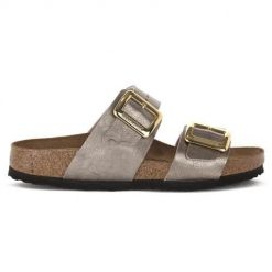Klapki damskie Birkenstock Sydney. Żółte klapki damskie Birkenstock, bez wzorów, z materiału, bez obcasa. Za 653.15 zł.
