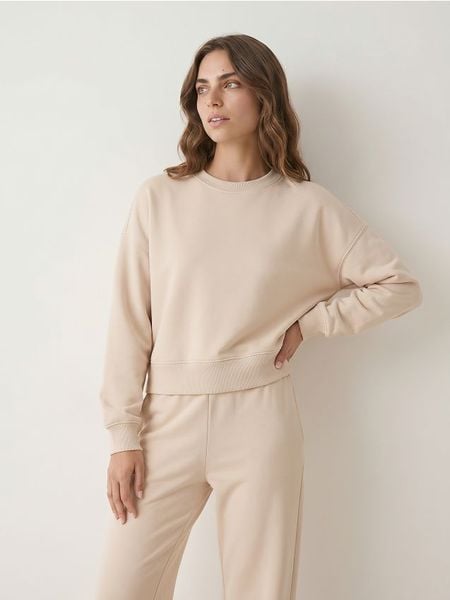 Krótka bluza crewneck - beżowy. Brązowe bluzy damskie Sinsay, l, bez wzorów, bez kaptura. Za 49.99 zł.