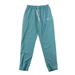 Second life - Nike spodnie dresowe męskie tapered fit - Stan dobry. Niebieskie spodnie sportowe męskie Nike, l, bez wzorów, z dresówki, do biegania. Za 106.46 zł.