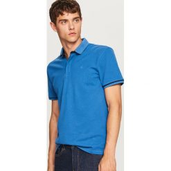 Koszulka polo - Niebieski. Niebieskie koszulki polo męskie Reserved. Za 79.99 zł.