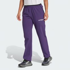 Spodnie Terrex Multi Liteflex. Fioletowe spodnie sportowe damskie Adidas, m, bez wzorów, z materiału, trekkingowe. W wyprzedaży za 239.85 zł.