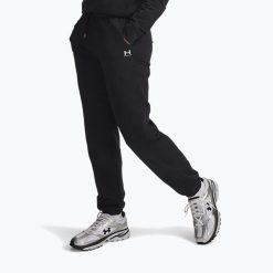 Spodnie damskie Under Armour Sport Terry Jogger /. Czarne spodnie sportowe damskie Under Armour, bez wzorów, na fitness i siłownię. Za 159.99 zł.