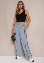 Niebieskie Szerokie Spodnie Dresowe High Waist Zdobione Lampasami Sopaline. Niebieskie spodnie dresowe damskie Renee, l, z aplikacjami, z dresówki, trekkingowe. Za 49.99 zł.
