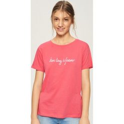 T-shirt z napisem - Pomarańczo. T-shirty damskie marki Sinsay. Za 19.99 zł.