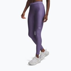 Legginsy treningowe damskie Under Armour HeatGear. Fioletowe legginsy sportowe damskie Under Armour, bez wzorów, na fitness i siłownię. Za 129.99 zł.