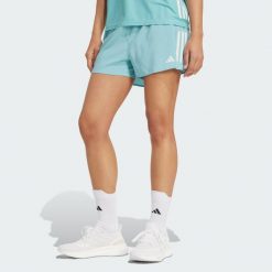 Szorty Own the Run. Zielone szorty sportowe damskie Adidas, bez wzorów, sportowe, do biegania. W wyprzedaży za 139.62 zł.