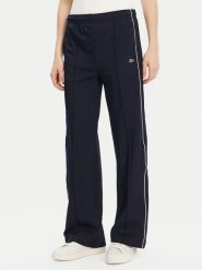 Lacoste Spodnie dresowe XF7260 Granatowy Relaxed Fit. Niebieskie spodnie dresowe damskie Lacoste, bez wzorów, z dresówki. Za 379.99 zł.