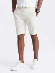Szorty męskie dresowe przed kolano BASIC – kremowe V5. Białe krótkie spodenki sportowe męskie Ombre Clothing, m, bez wzorów, z bawełny. W wyprzedaży za 49.99 zł.