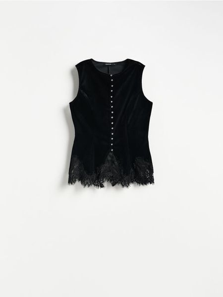 Welurowa bluzka z koronką - czarny. Czarne bluzki damskie Reserved, l, bez wzorów, z koronki, bez kołnierzyka, bez ramiączek. Za 179.99 zł.