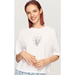 T-shirt z nadrukiem - Biały. T-shirty damskie marki DOMYOS. W wyprzedaży za 19.99 zł.