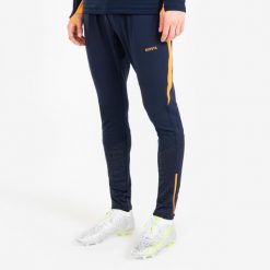 Spodnie piłkarskie Kipsta CLR. Brązowe spodnie sportowe męskie KIPSTA, l, bez wzorów, z materiału, do piłki nożnej. Za 139.99 zł.