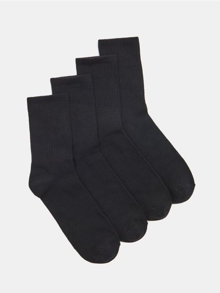 Prążkowane skarpetki 4 pack - czarny. Czarne skarpety damskie Sinsay, bez wzorów, prążkowane. Za 12.99 zł.