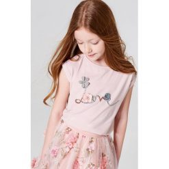 Dziewczęca koszulka z błyszczącą aplikacją little princess - Różowy. T-shirty damskie marki bonprix. W wyprzedaży za 19.99 zł.