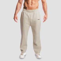 Spodnie męskie fitness oversize szare Aura. Szare spodnie sportowe męskie GYMBEAM, m, bez wzorów, z bawełny, na fitness i siłownię. Za 139.90 zł.