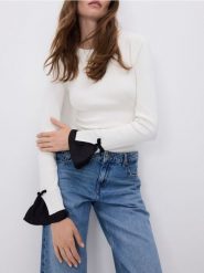 Sweter z dekoracyjnymi kokardami - złamana biel. Swetry damskie Reserved, l, bez wzorów, z dzianiny, bez kołnierzyka, bez ramiączek, bez kaptura. Za 119.99 zł.