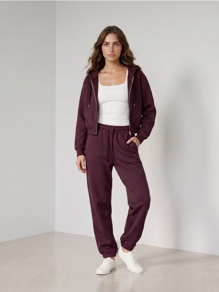 Spodnie dresowe jogger - czerwony. Czerwone spodnie dresowe damskie Sinsay, l, bez wzorów, z dresówki. Za 29.99 zł.