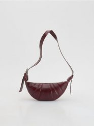 Torebka saszetka - bordowy. Czerwone torebki do ręki damskie Reserved, bez wzorów, ze skóry, klasyczne, bez dodatków. Za 129.99 zł.