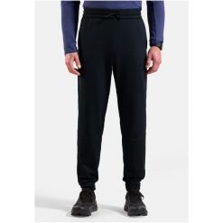 Spodnie dresowe Odlo Pants regular length ESSENTIAL THERMAL. Czarne spodnie sportowe męskie Odlo, na lato, bez wzorów, z dresówki, trekkingowe. Za 384.70 zł.