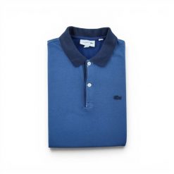 Second life - Lacoste koszulka polo męska krótki rękaw - Stan bardzo dobry. Niebieskie koszulki polo męskie Lacoste, l, bez wzorów, z materiału, bez kołnierzyka, bez ramiączek, tenisowe. Za 127.76 zł.