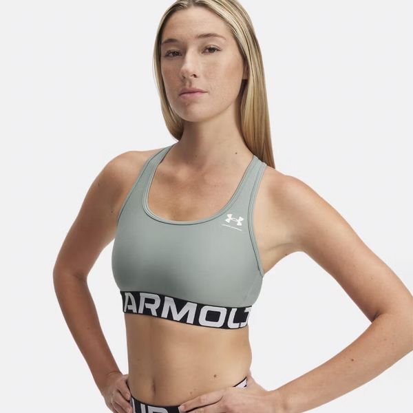 Stanik sportowy Under Armour HeatGear Authentics Mid Branded Bra. Zielone obuwie sportowe damskie Under Armour, bez wzorów, na fitness i siłownię. Za 102.99 zł.