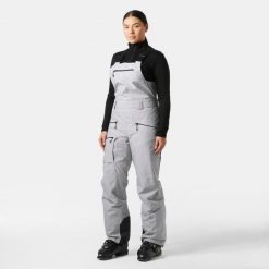Kombinezon narciarski damski z szelkami Helly Hansen Powderqueen 2.0. Szare spodnie snowboardowe damskie Helly Hansen, na zimę, bez wzorów, sportowe, narciarskie. Za 1,305.50 zł.