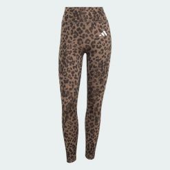 Legginsy Optime Essentials 3-Stripes Leopard 7/8. Brązowe legginsy damskie Adidas, l, bez wzorów, z elastanu, z podwyższonym stanem, na fitness i siłownię, climacool (adidas). Za 219.00 zł.