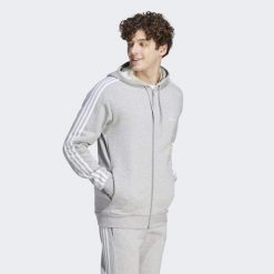 Bluza z kapturem Essentials Fleece 3-Stripes Full-Zip. Szare bluzy męskie Adidas, s, bez wzorów, z bawełny, z kapturem, na fitness i siłownię. Za 229.99 zł.