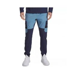 Spodnie dresowe Under Armour TECH UTILITY WOVEN. Niebieskie spodnie sportowe męskie Under Armour, s, bez wzorów, z dresówki, na fitness i siłownię. Za 345.15 zł.