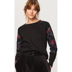 Bluza z ozdobnymi rękawami - Czarny. Bluzy damskie marki KALENJI. W wyprzedaży za 69.99 zł.