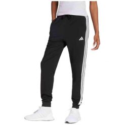 Damskie spodnie dresowe adidas Essentials 3-Stripes. Czarne spodnie dresowe damskie Adidas, s, bez wzorów, z bawełny. Za 224.20 zł.